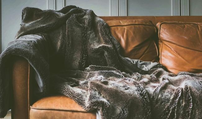 a chair with a blanket on it